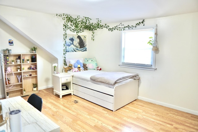 bedroom featuring hardwood / wood-style flooring