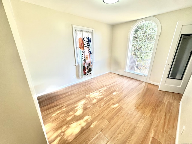 spare room featuring light hardwood / wood-style flooring