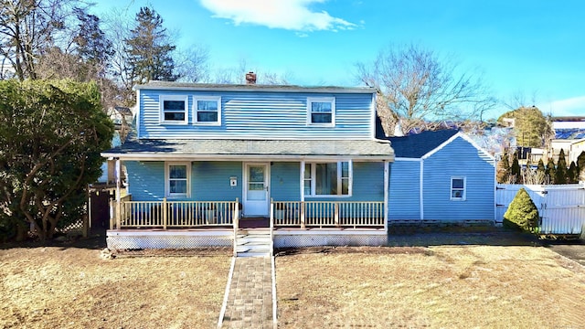 front of property featuring a front yard and covered porch