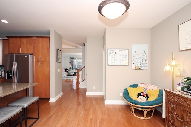 living area with light hardwood / wood-style floors