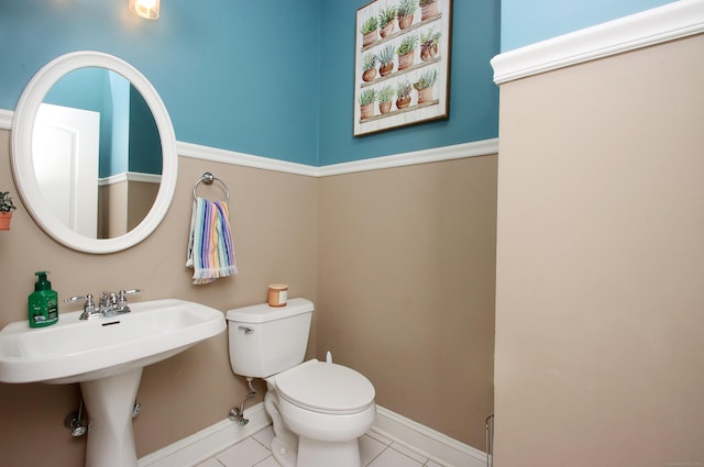 bathroom with tile patterned floors and toilet