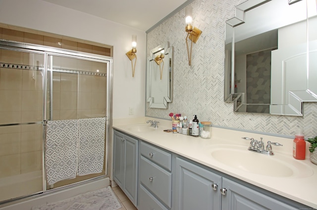 bathroom featuring vanity, tile patterned floors, and a shower with shower door