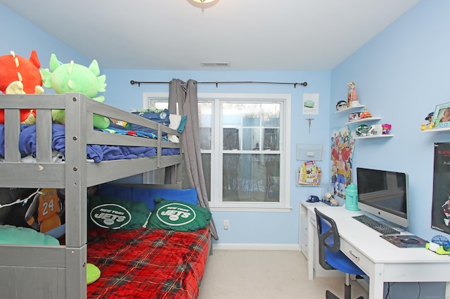 bedroom with light colored carpet