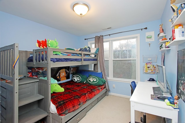 bedroom featuring light carpet