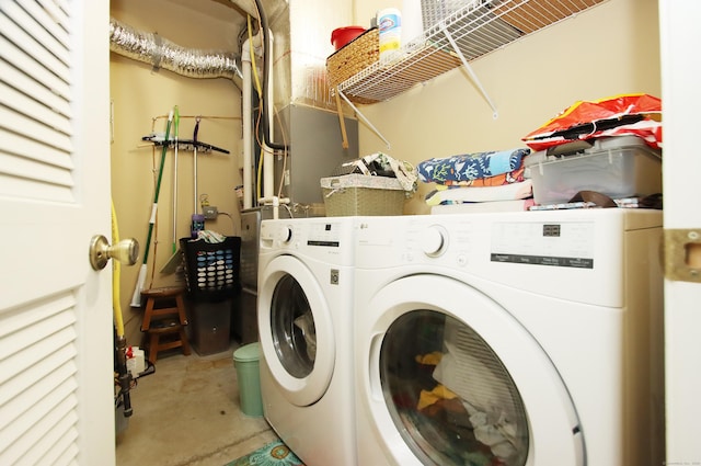 laundry room featuring washing machine and clothes dryer