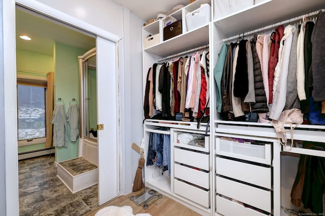 closet with a baseboard radiator