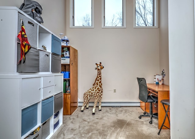 carpeted home office featuring baseboard heating