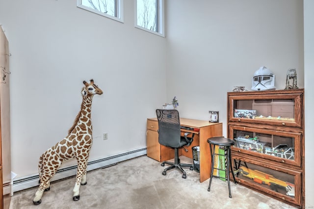 carpeted office space with a baseboard radiator