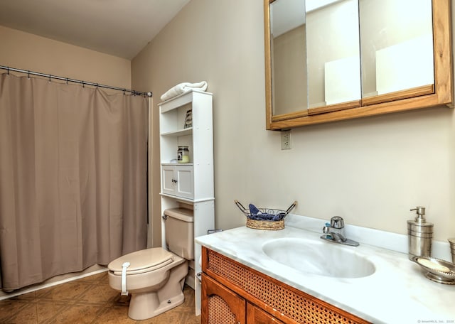 bathroom with vanity, walk in shower, and toilet