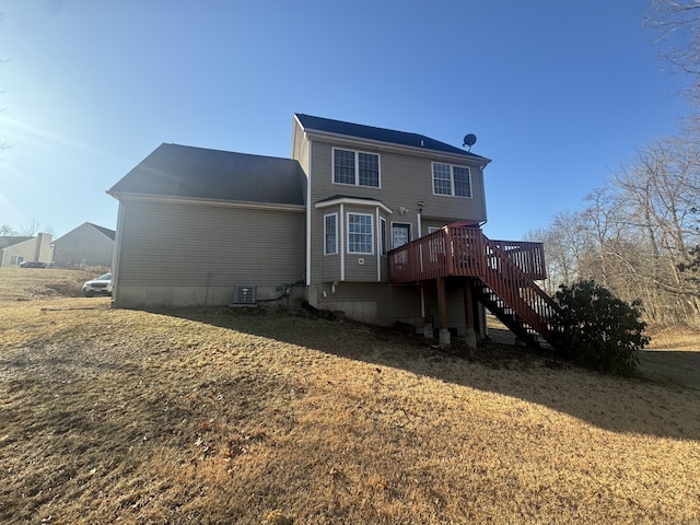 rear view of house featuring stairs, central AC, and a wooden deck