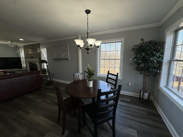 dining room with dark wood-type flooring, a notable chandelier, and a healthy amount of sunlight