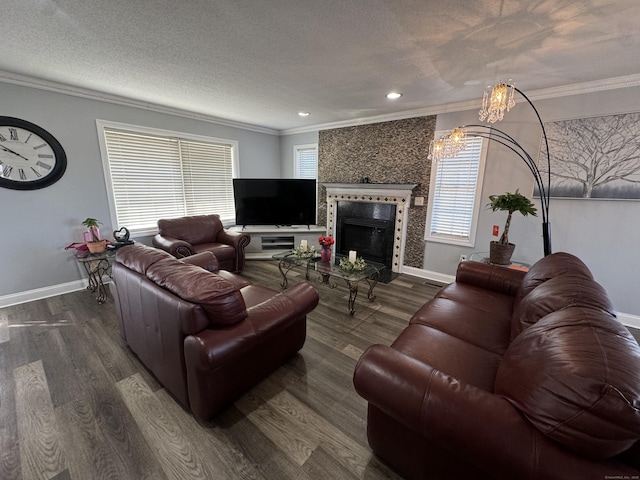 living room with wood finished floors, a chandelier, and crown molding