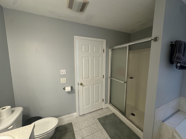 bathroom featuring visible vents, toilet, a textured ceiling, a shower stall, and tile patterned flooring