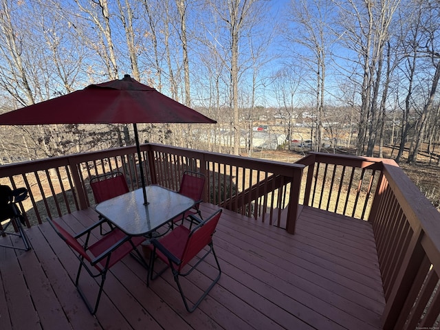 wooden deck with outdoor dining space