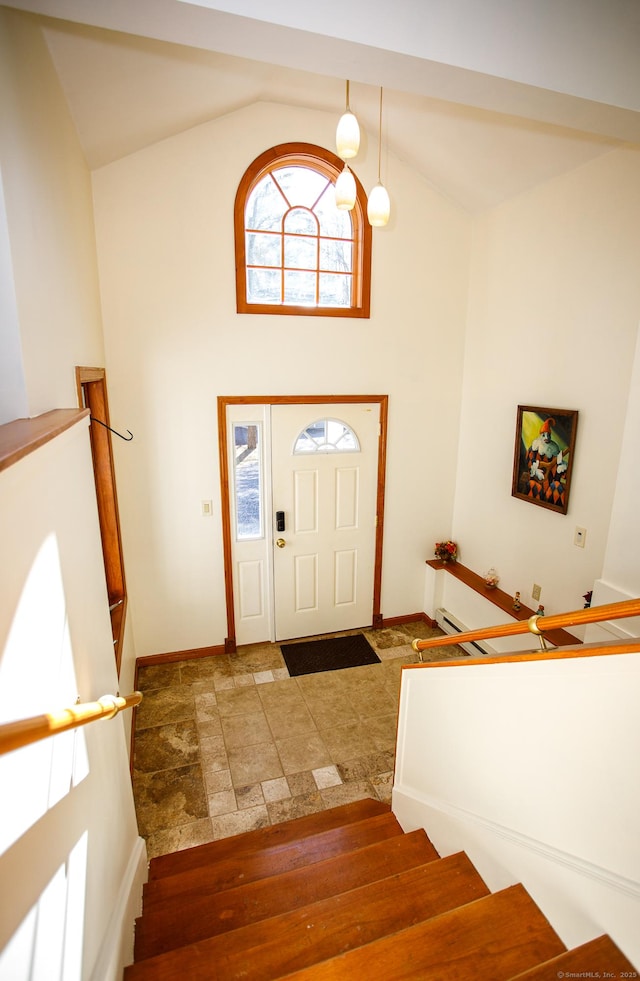 foyer featuring high vaulted ceiling and a wealth of natural light