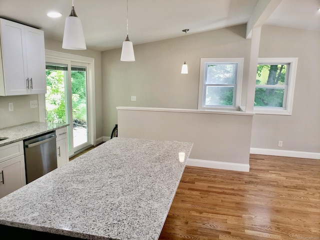 kitchen featuring dishwasher, pendant lighting, white cabinets, and light stone counters