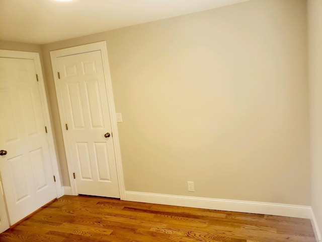 empty room featuring wood-type flooring