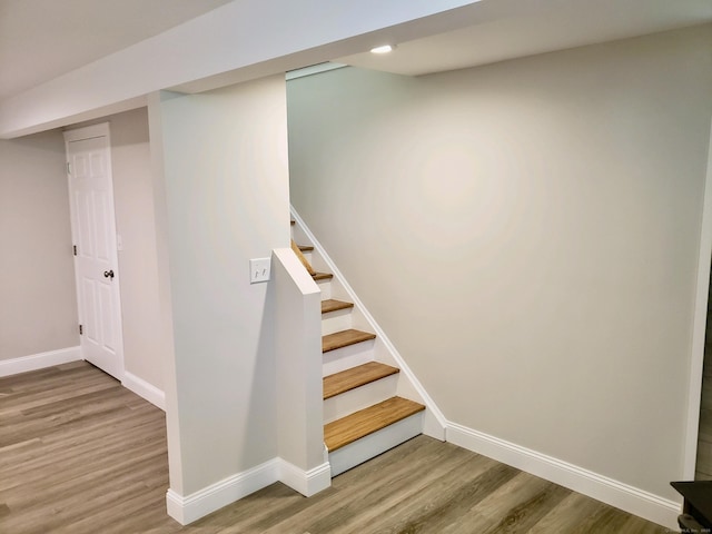 stairway with wood-type flooring