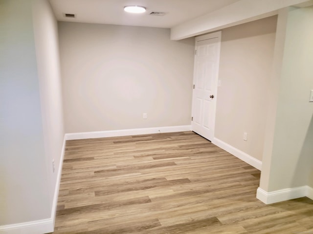 spare room featuring light hardwood / wood-style flooring