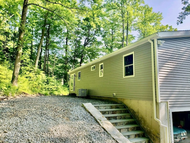 view of property exterior with central AC unit