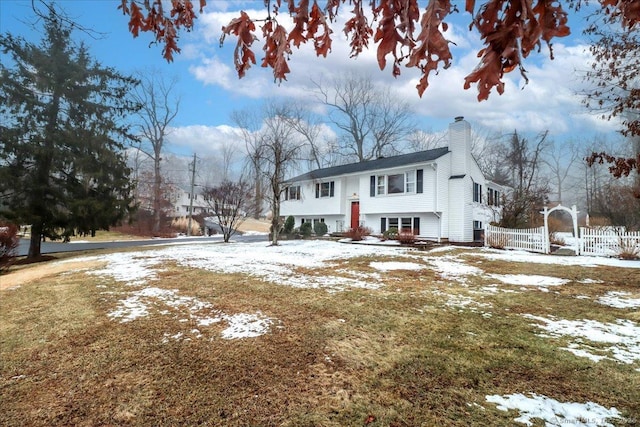 bi-level home featuring a lawn