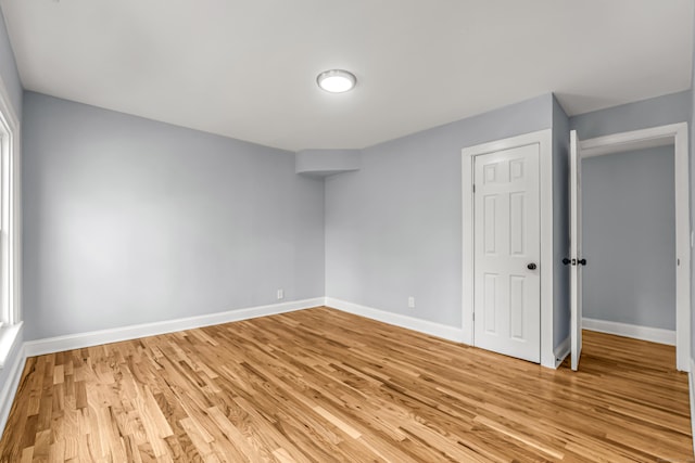 unfurnished room with light hardwood / wood-style flooring