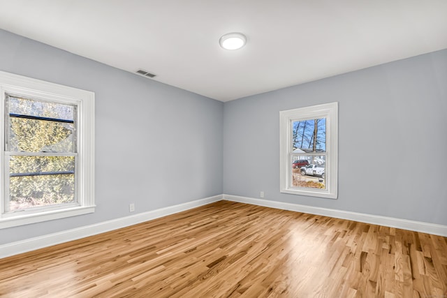 unfurnished room with light hardwood / wood-style flooring