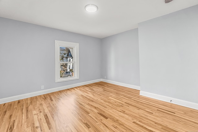 spare room featuring light hardwood / wood-style flooring