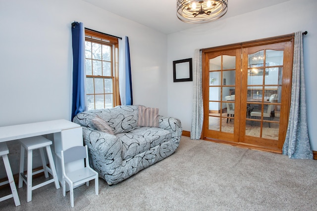 sitting room featuring light colored carpet