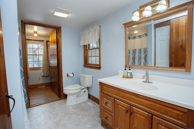 bathroom with vanity and toilet