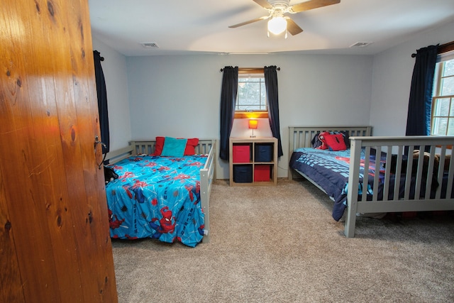 carpeted bedroom featuring ceiling fan