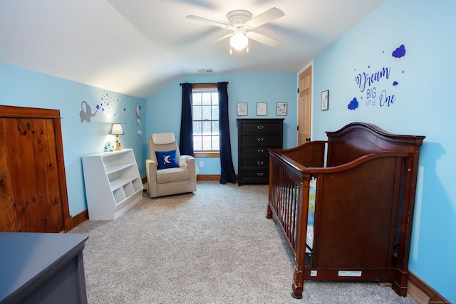 bedroom featuring vaulted ceiling, light colored carpet, and ceiling fan