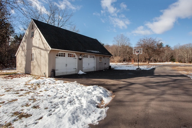 view of snow covered garage