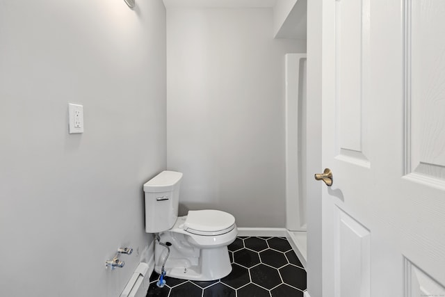 bathroom featuring tile patterned flooring and toilet