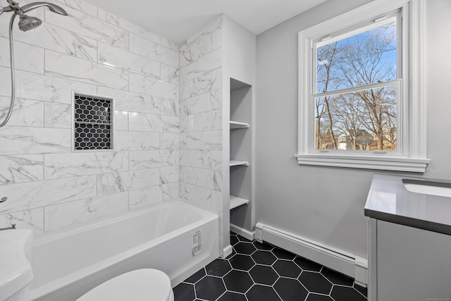 full bathroom with toilet, vanity, tiled shower / bath combo, tile patterned flooring, and a baseboard heating unit