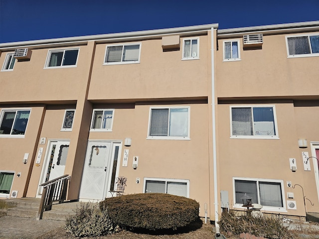 view of building exterior with entry steps