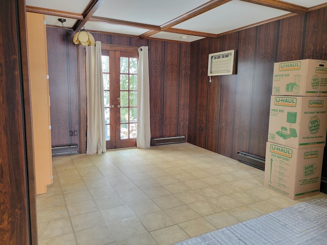 empty room featuring french doors, coffered ceiling, baseboard heating, wooden walls, and a wall unit AC