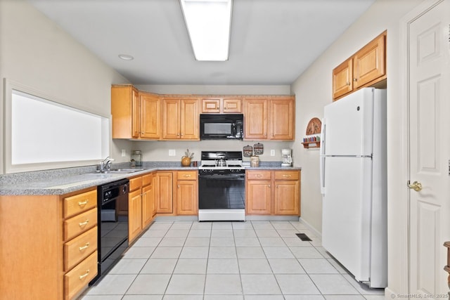 kitchen with sink, light brown cabinets, black appliances, and light tile patterned flooring