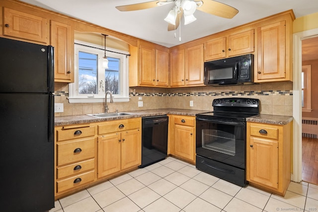 kitchen with sink, light tile patterned floors, radiator, tasteful backsplash, and black appliances