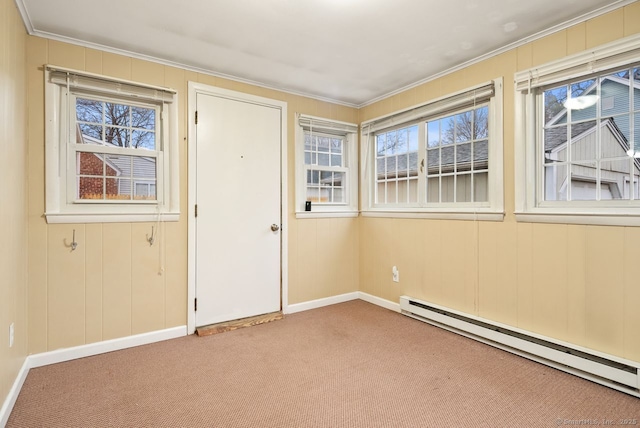 interior space featuring ornamental molding and baseboard heating