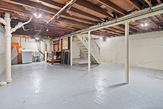 basement featuring washer / dryer and sink