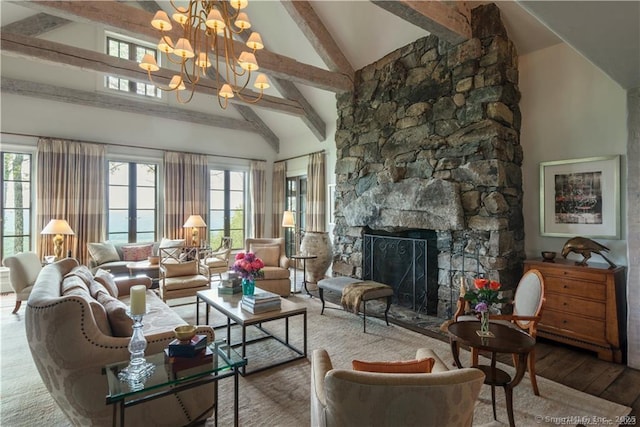 living room with a stone fireplace, a chandelier, high vaulted ceiling, beam ceiling, and hardwood / wood-style floors