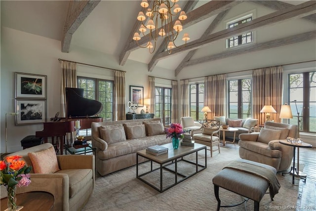 living room featuring a notable chandelier, plenty of natural light, and high vaulted ceiling