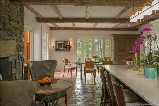 interior space with a fireplace and beamed ceiling