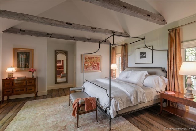 bedroom with wood-type flooring and vaulted ceiling with beams