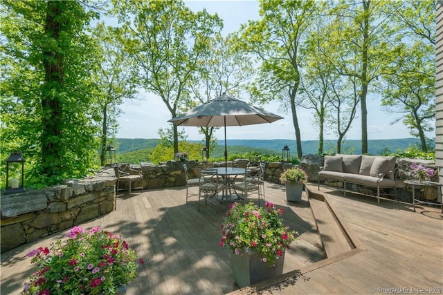 view of patio with a wooden deck and an outdoor hangout area