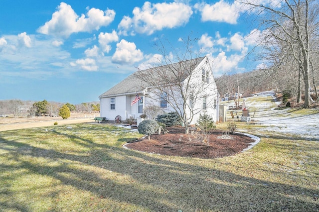 view of front of home with a front lawn