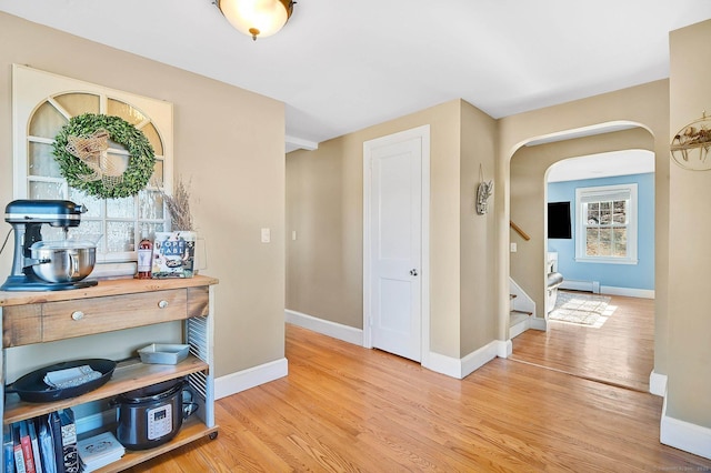 hallway with light wood-type flooring