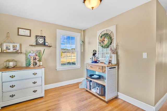 living area with light hardwood / wood-style flooring