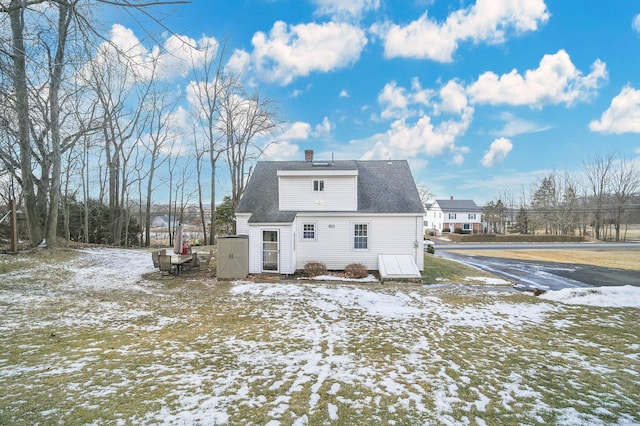 view of snow covered house